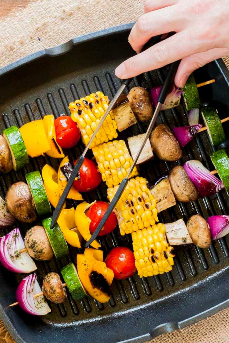 four homemade Vegetable Kabobs on a grill