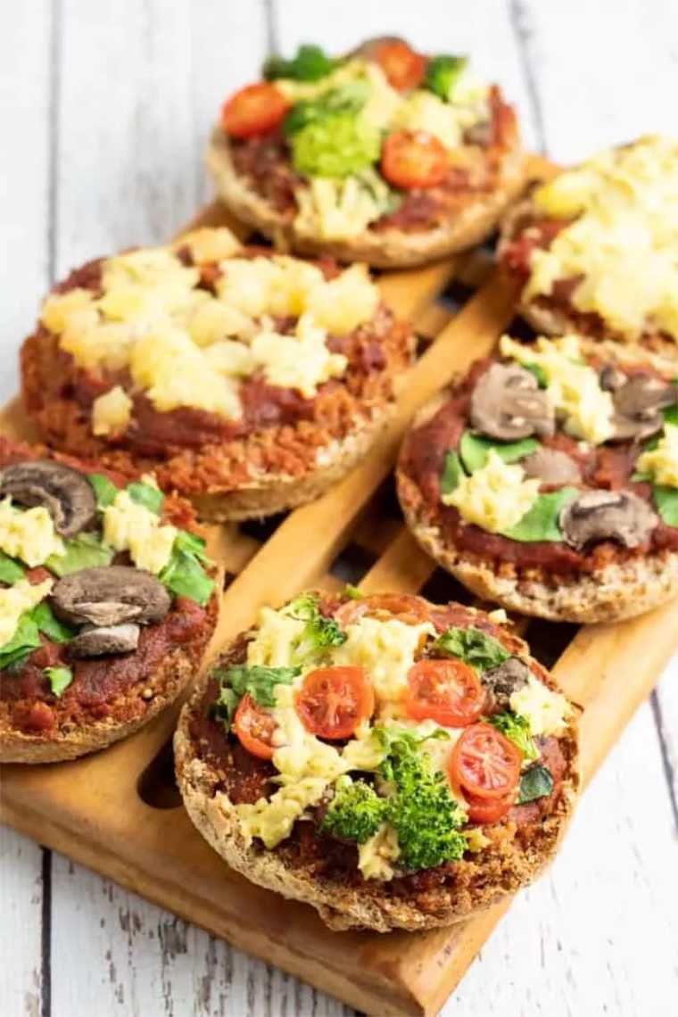 wooden board with six vegan English Muffin Mini Pizzas perfect for kids