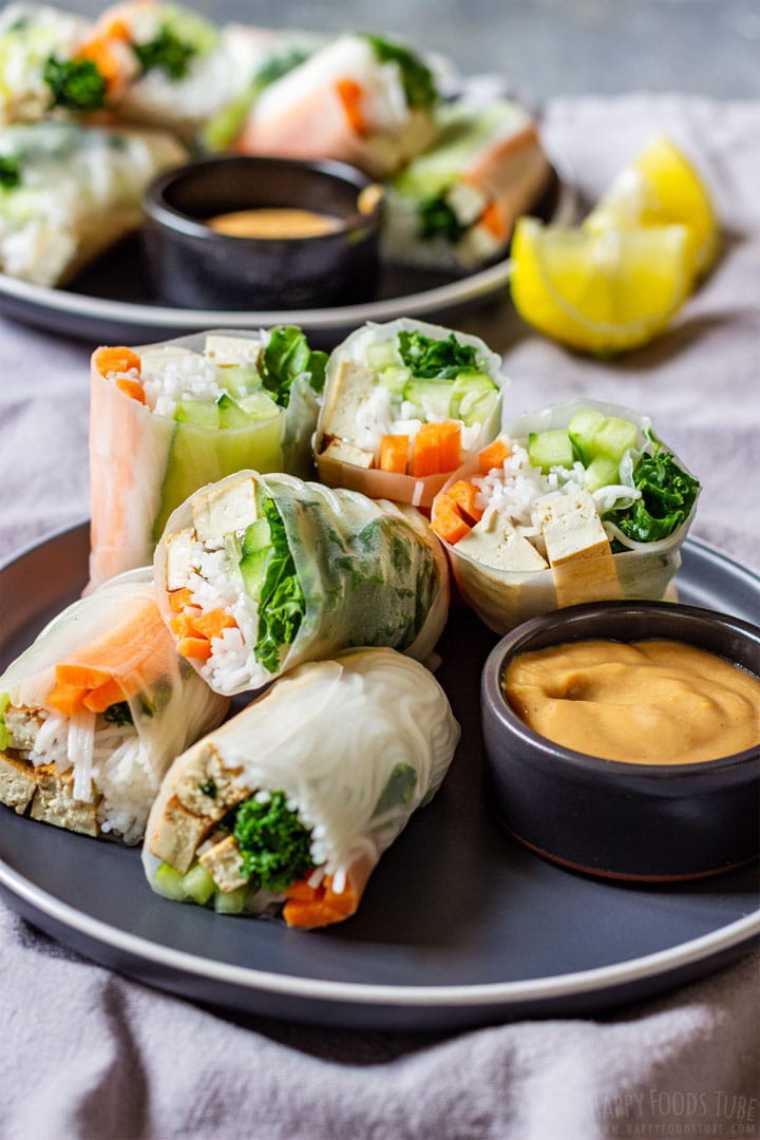 close up of plate with 6 homemade vegan tofu spring rolls and dipping sauce