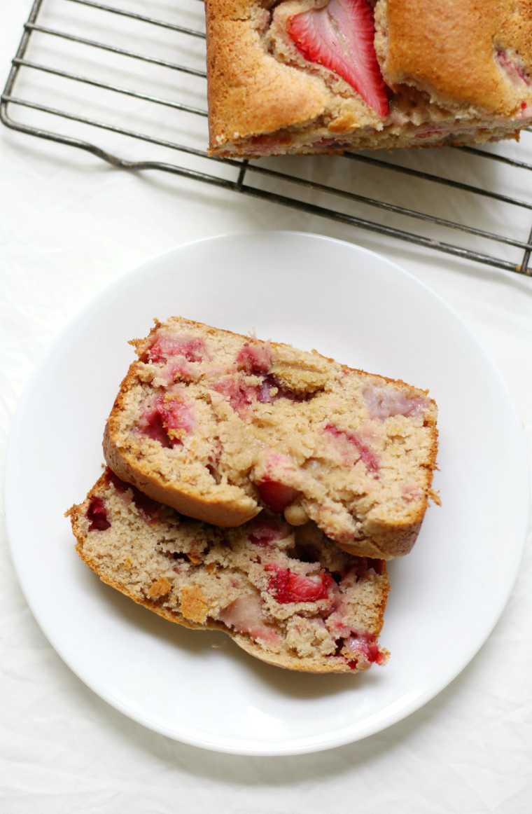 white plate with two slices of vegan Strawberry Quick Bread
