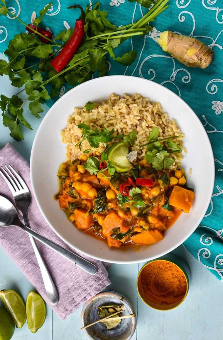 white plate with creamy vegan pumpkin curry and rice