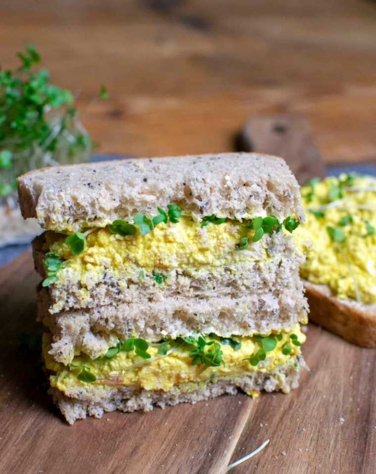 two vegan Tofu egg mayo sandwiches on top of each other