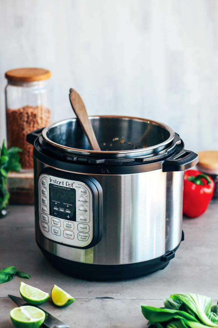 Instant Pot with vegetables and beans on table