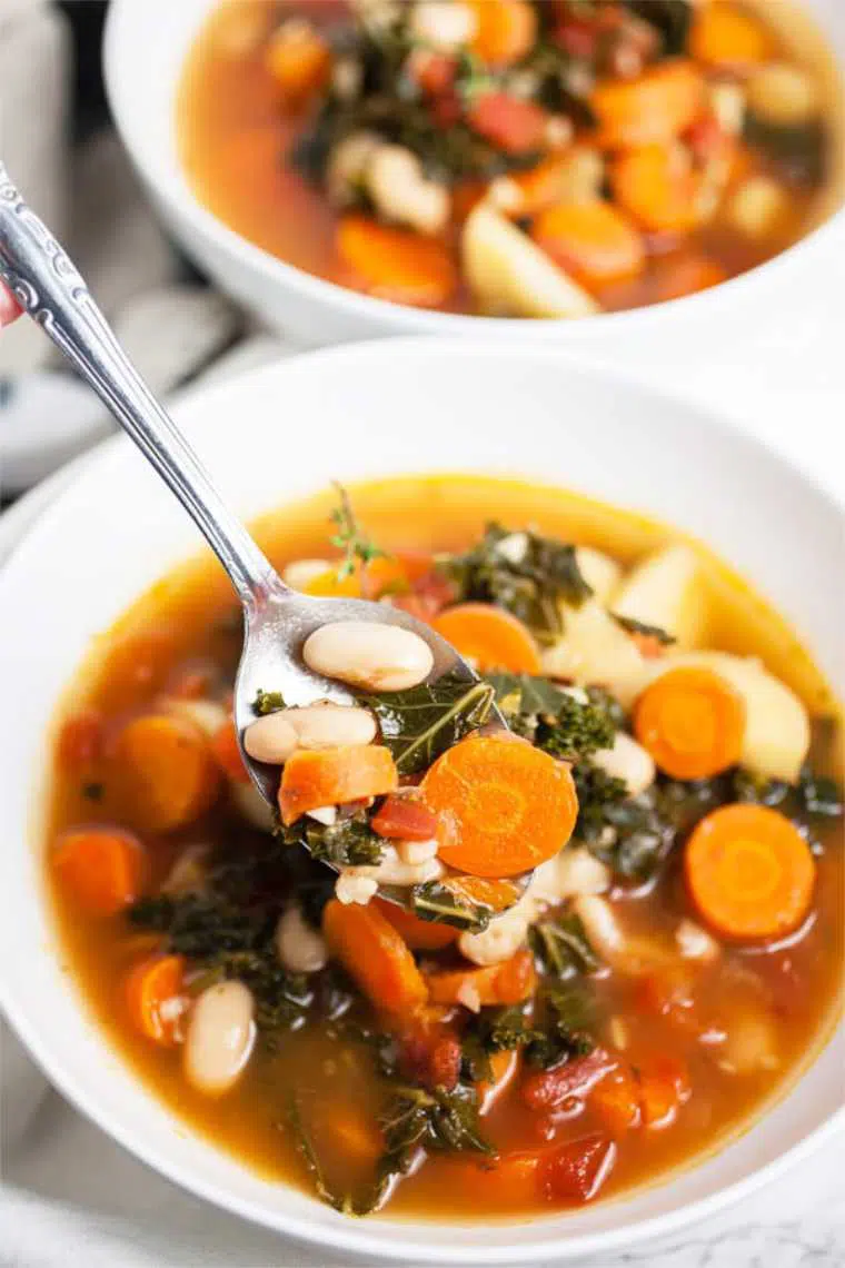 two white bowls with healthy Harvest Vegetable Soup perfect for fall and winter