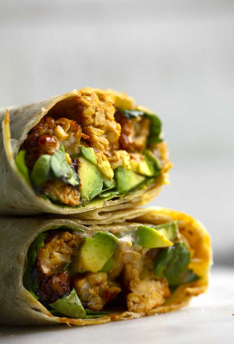 close-up of two tempeh and avocado stuffed wraps
