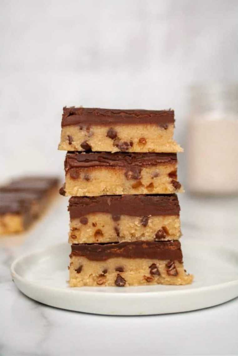 white plate with four Cookie Dough Bars on top of each other