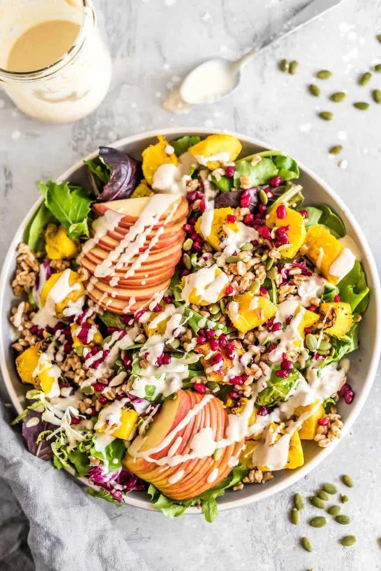 colorful bowl full of vegan Roasted Squash Farro Salad as a Christmas recipe idea