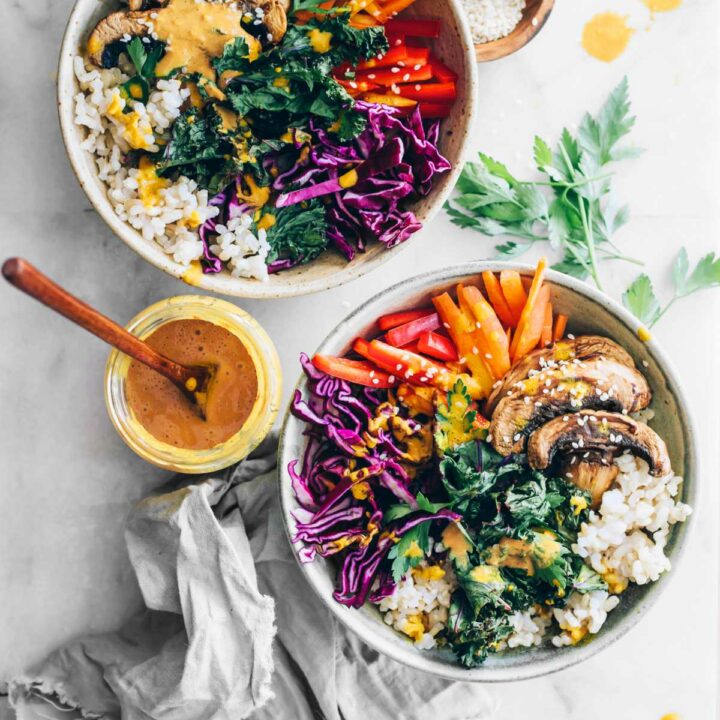 two colorful vegan Korean rice bowls on a table