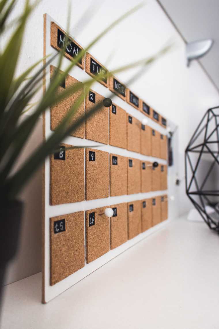 Calendar with cork elements  on a white surface