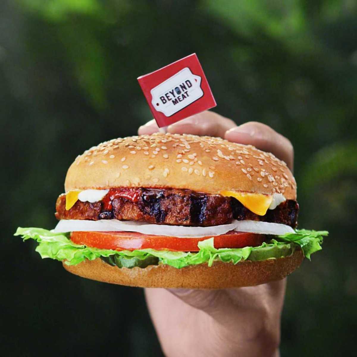 hand holding Beyond Meat vegan burger