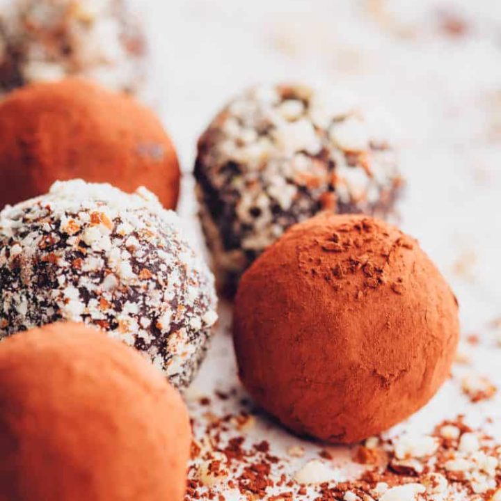 close up of half a dozen homemade almond and chocolate bliss balls