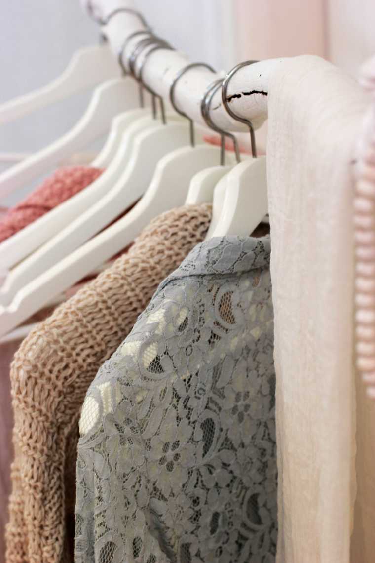 close up of several clothes on a rack
