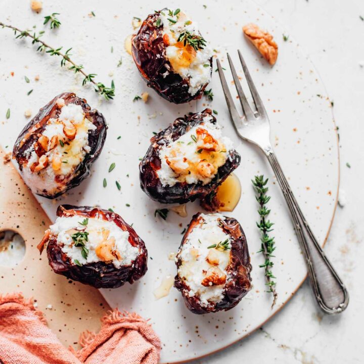 Cream Cheese Stuffed Dates with herbs on a plate