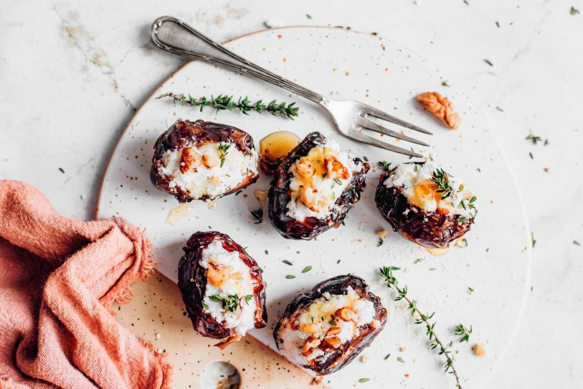 Cream Cheese Stuffed Dates next to a towl