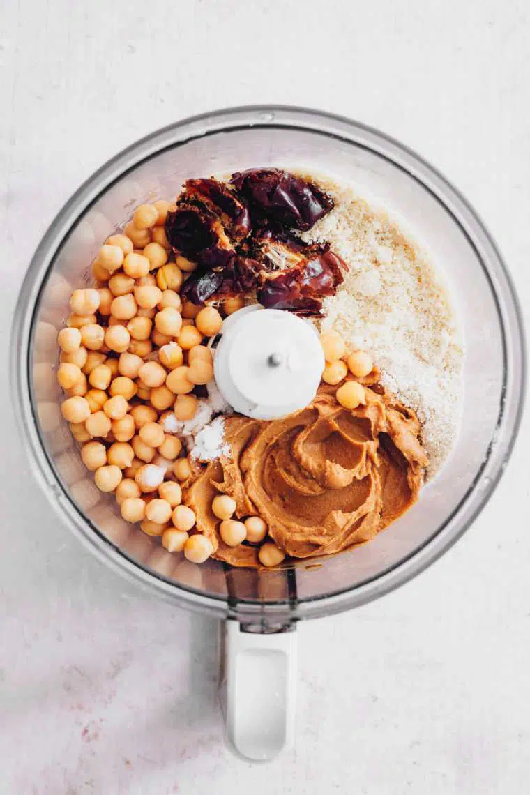 food processor with chickpeas, flour, dates and peanut butter