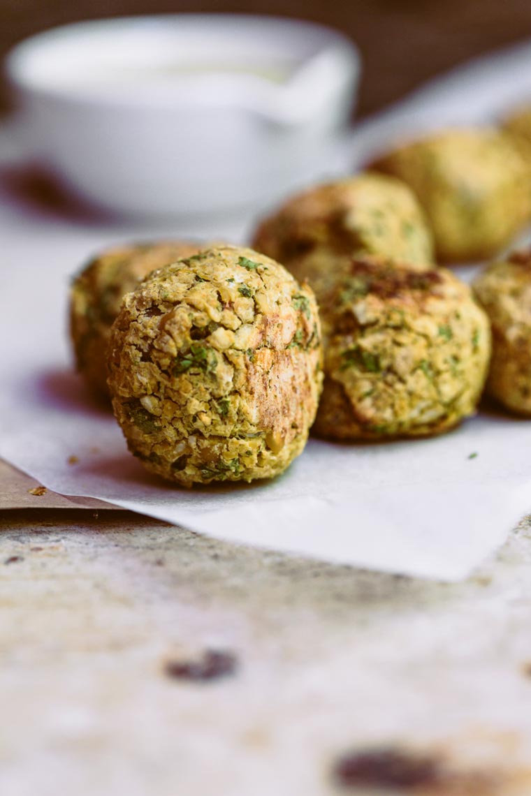 several oil-free baked falafel made from chickpeas on some parchment paper
