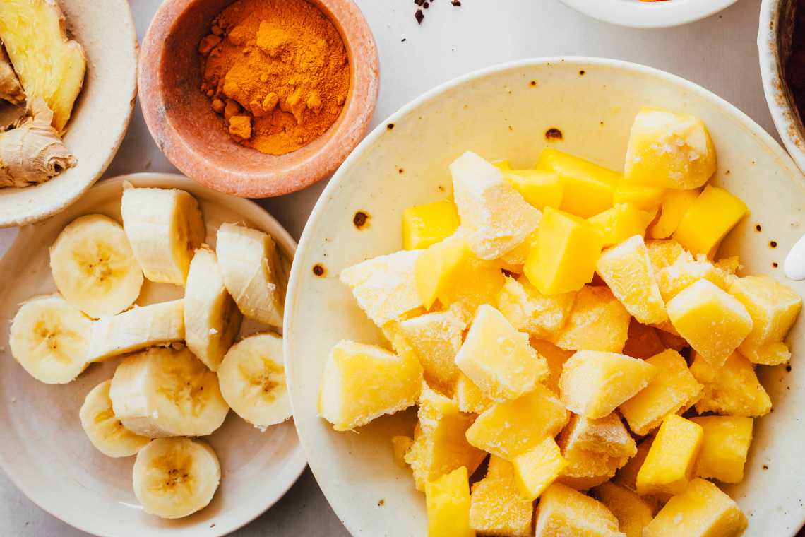 frozen mango and frozen banana in bowls