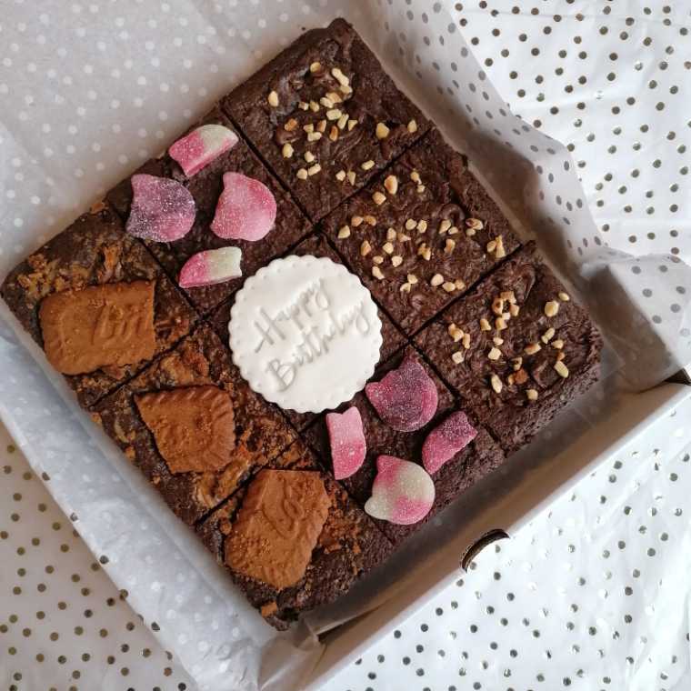 nine pieces of homemade vegan brownies in a box
