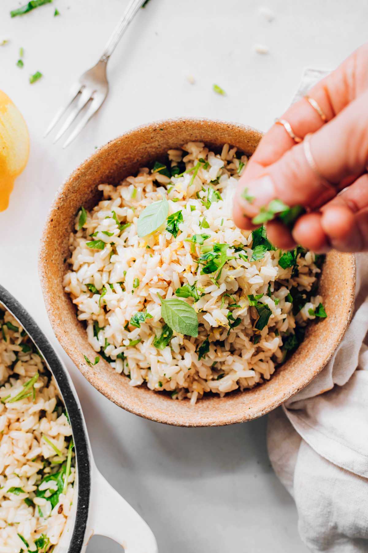 topping rice with herbs