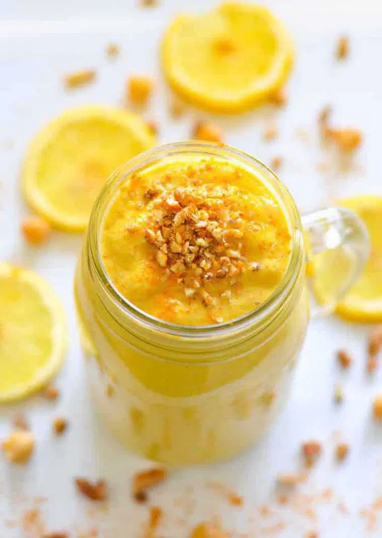glass with creamy vegan superfood lemon cheesecake smoothie