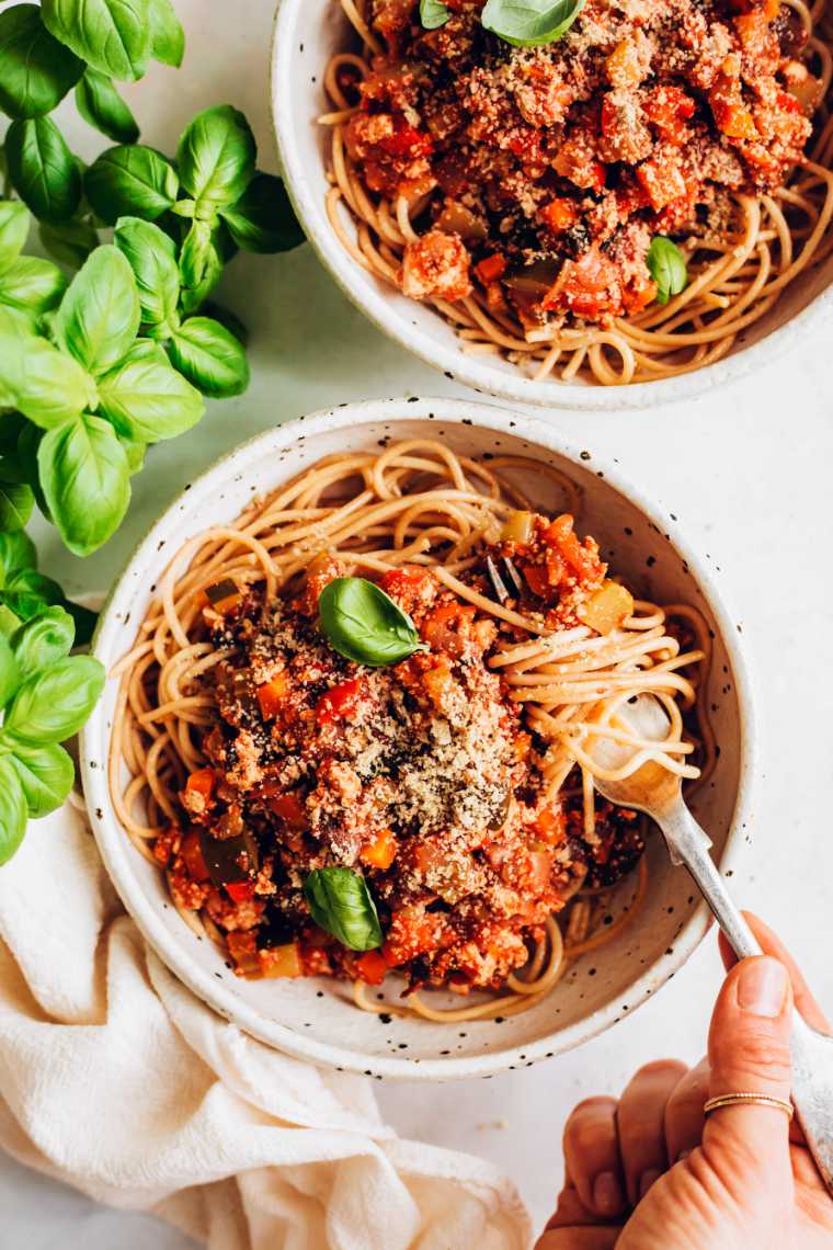 two bowls of pasta bolognese