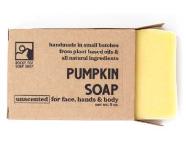 handmade orange pumpkin soap bar in biodegradable packaging