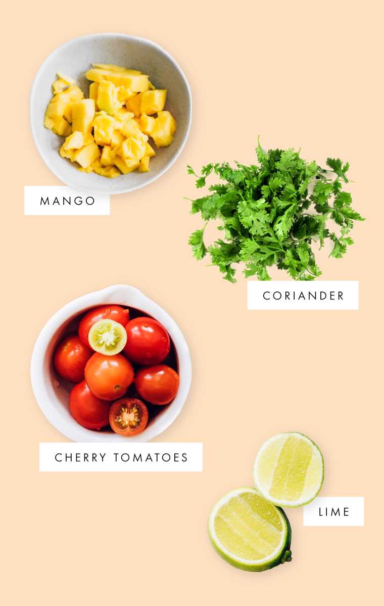 mango, tomato, coriander and lime on background