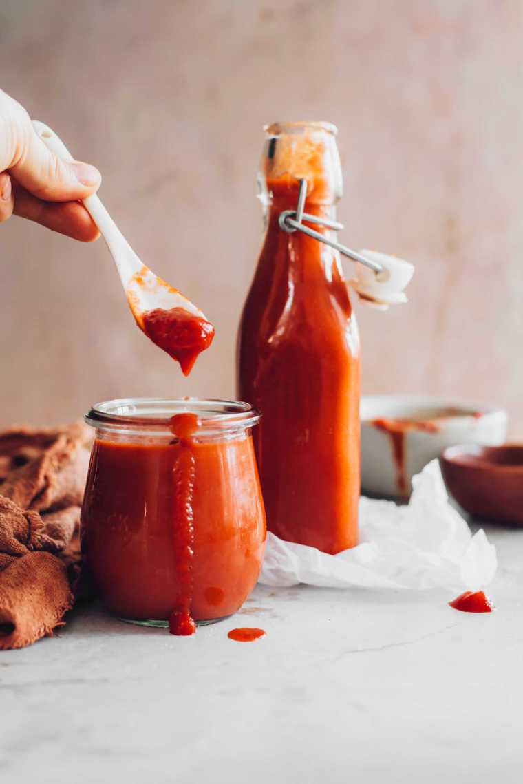 two glasses of homemade sugar-free ketchup on a table