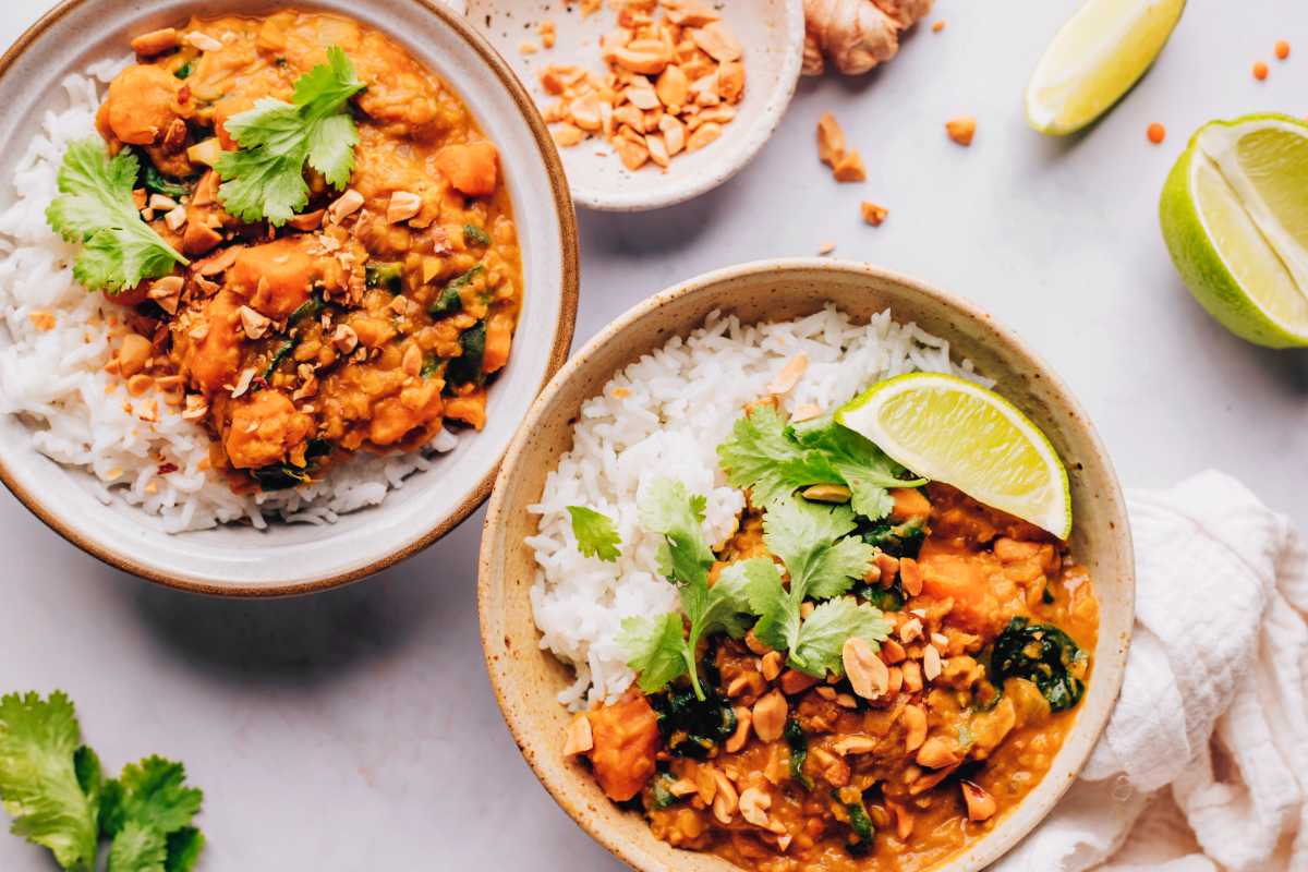 two bowls of satay sweet potato curry with rice