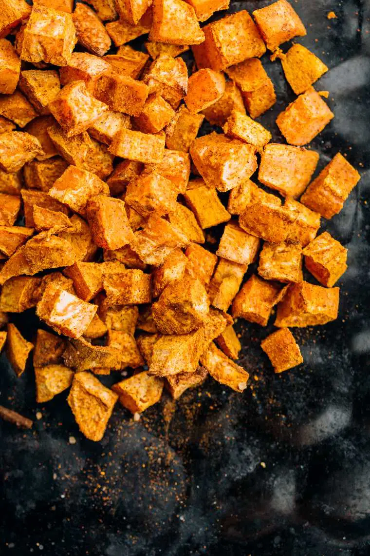 top view of golden roasted sweet potato cubes
