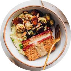 Top view of plate with Brussels sprouts and chickpea loaf