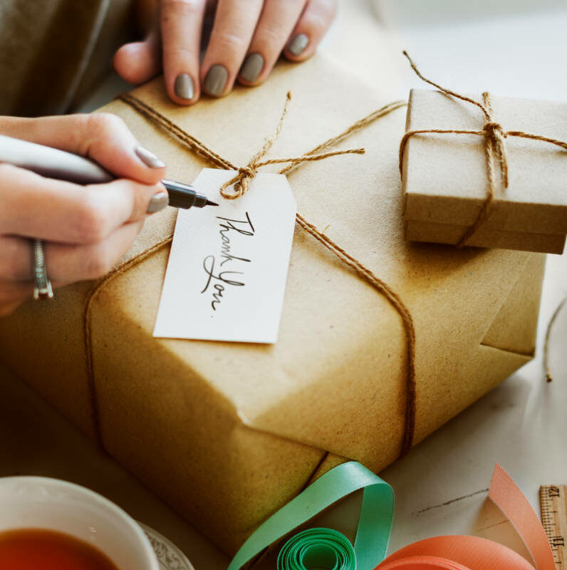woman wrapping vegan gifts