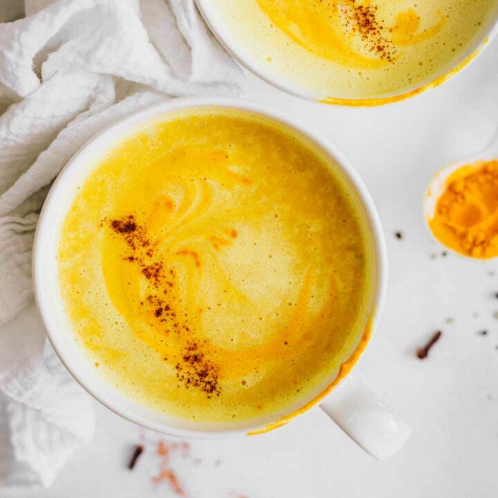 two vegan Turmeric Lattes on a table