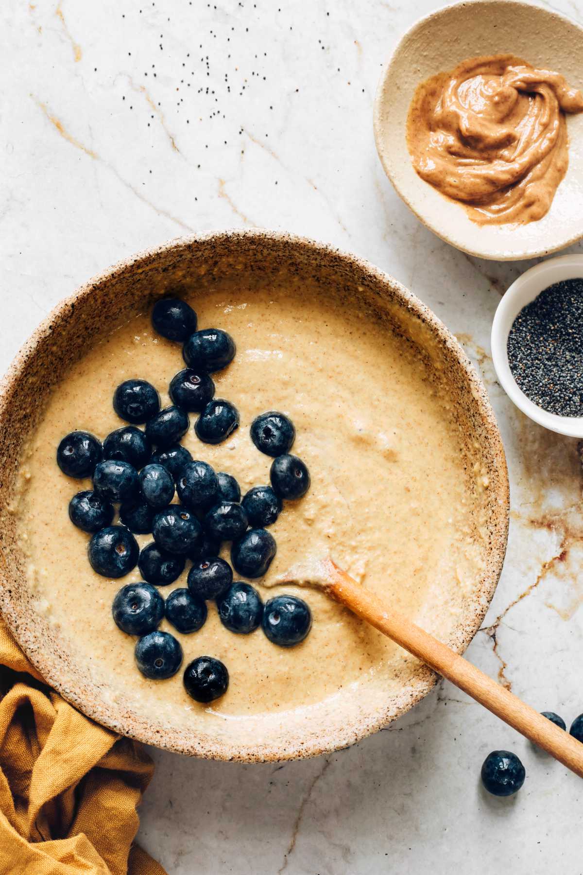 oatmeal pancake batter with blueberries in a bowl