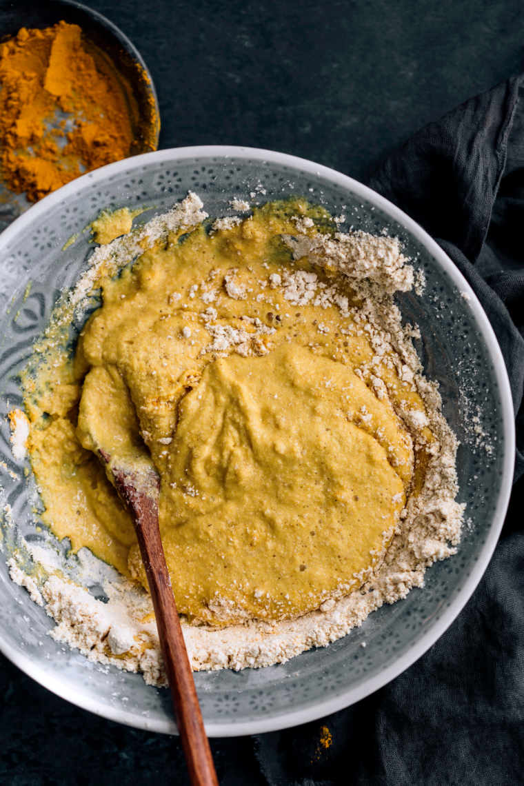 chickpea omelette mixing batter ingredients in bowl