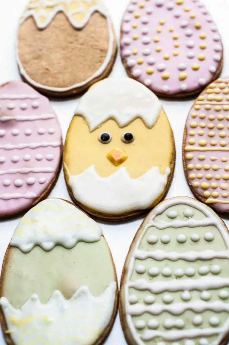 close up of several colorful Vegan Easter Cookies looking like eggs and chicks