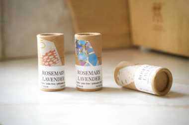 three vegan lip balms in biodegradable packaging on a table