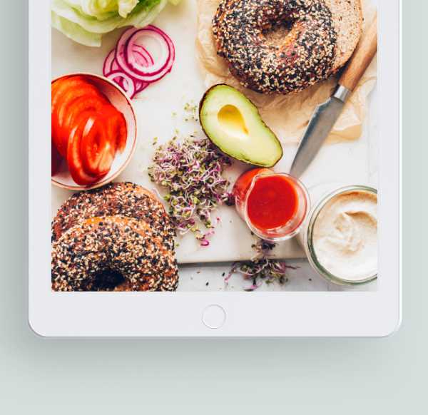 iPad with different plant-based foods on its screen representing Nutriciously's Vegan Starter Kit