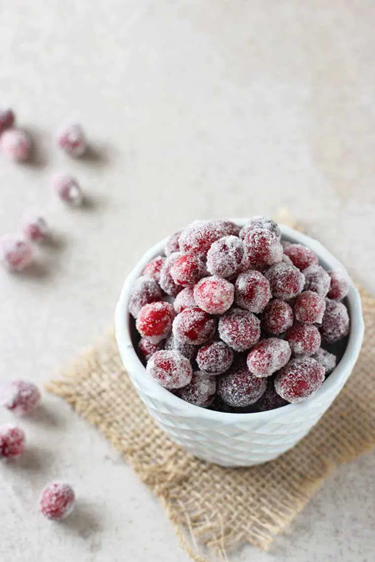white bowl of homemade sugared cranberries as a healthy and easy thanksgiving dessert