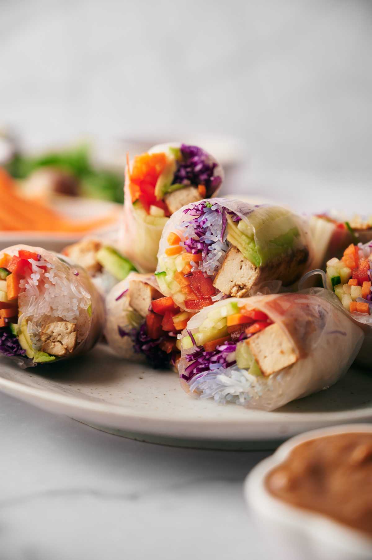 colorful summer rolls cut open to show filling