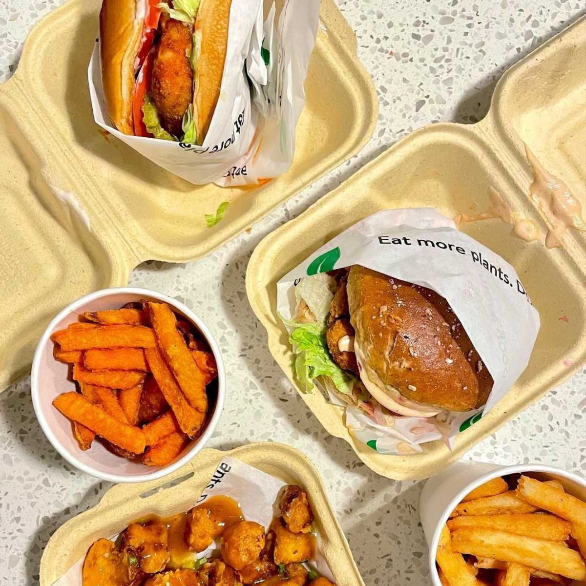 two vegan burgers and a selection of fast food sides