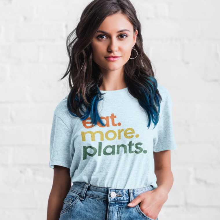 woman wearing a eat more plants shirt
