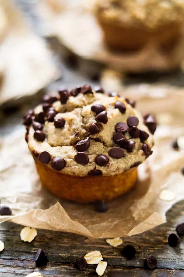 close up of one vegan protein muffin topped with chocolate chips which can be eaten as a post-workout snack