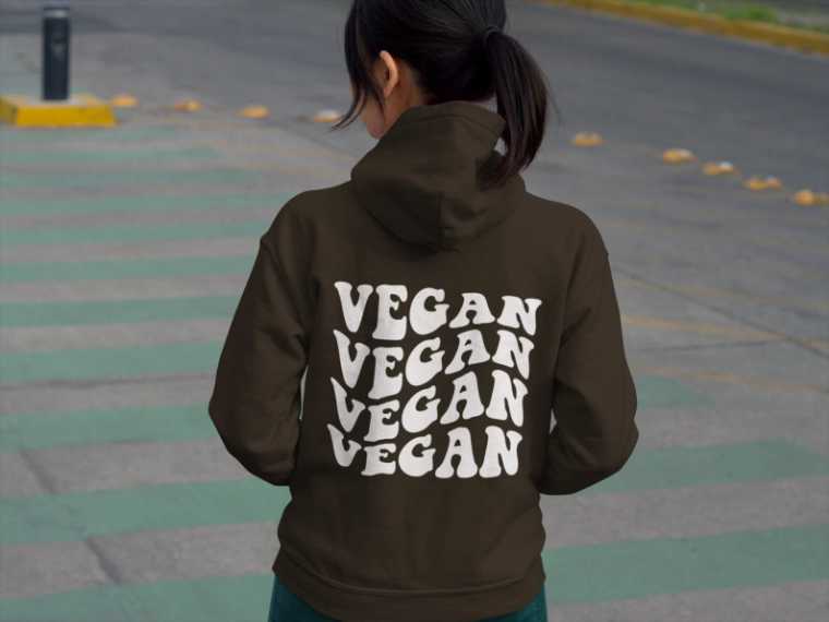 woman with dark hair wearing a vegan hoodie